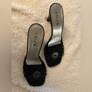 Unisa Black leather Sandals Heels with Design Emblishment on front.